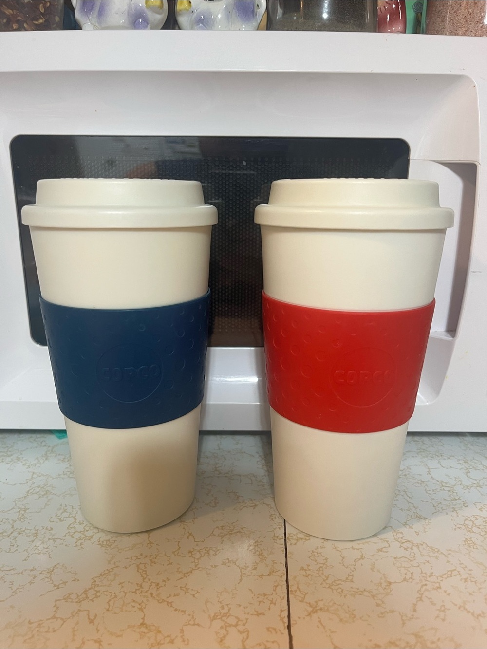 Reusable Cream Travel Mugs with Blue and Red Grips